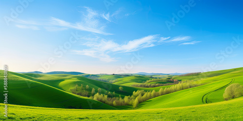 Spring landscape with green field and sky
