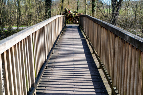 wooden pedestrian bridge over the river