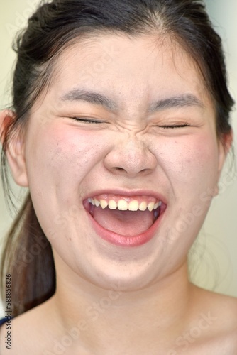 A Pretty Chinese Female Laughing