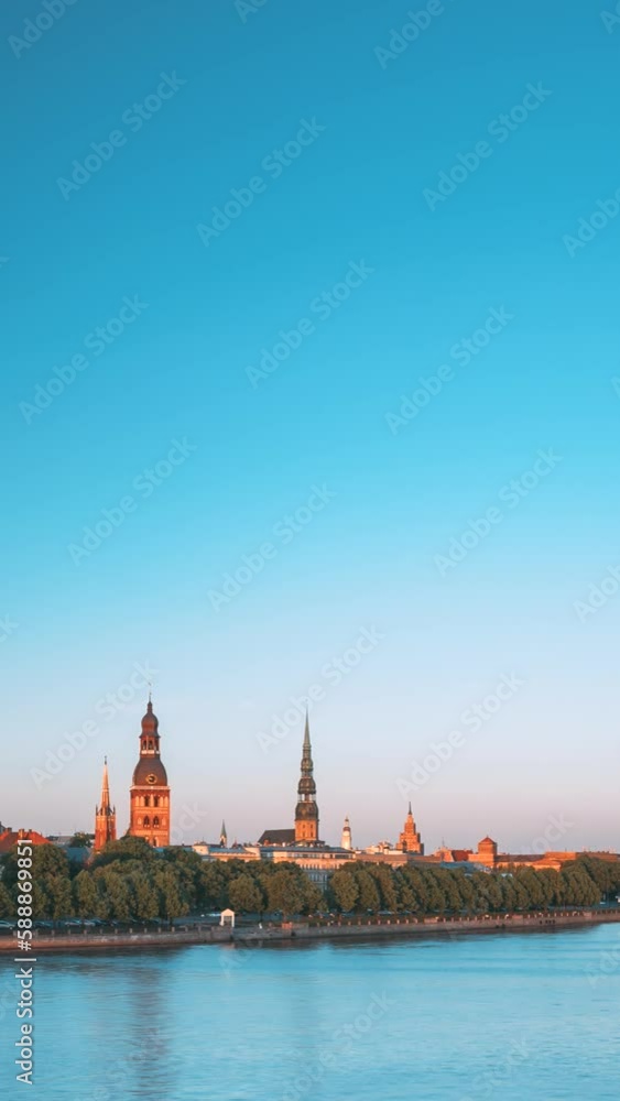 Riga, Latvia. city Cityscape skyline At Evening Of Riga, Latvia. Copyspace. Vertical Footage Video Urban View Of Castle, Cathedral And St. Peter's Church. Riga, Latvia. city Cityscape skyline At Evening Of Riga, Latvia. Copyspace. Vertical Footage Video Urban View Of Castle, Cathedral And St. Peter's Church.