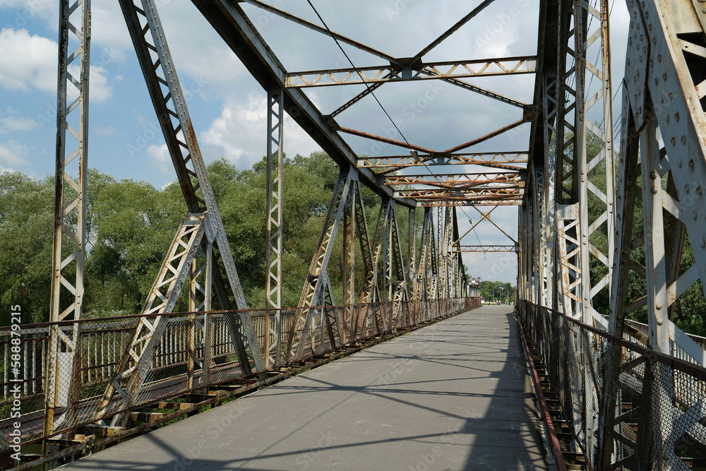 Fototapeta premium Old metal bridge across Dniester river in the city of Halych, western Ukraine