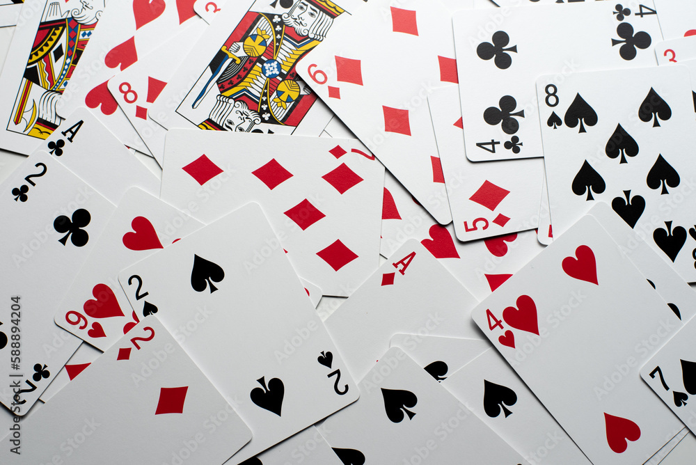 Scattered Playing Cards on a White Background Scattered Playing Cards on a White Background