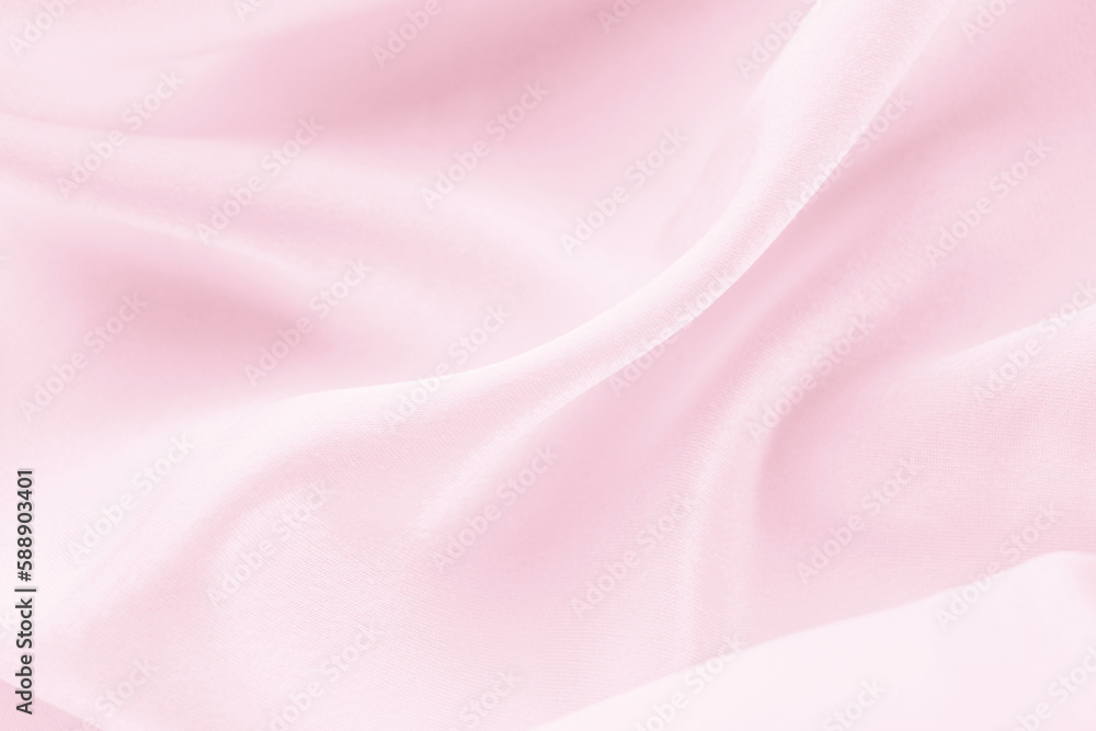 Fototapeta premium folds of pink silk fabric texture background