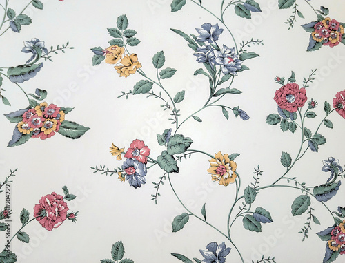 Close up of old-fashioned floral wallpaper pattern on an ivory-colored background photo