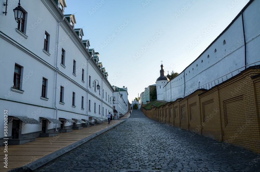 Cobbled street with residential buildings and church shops on the territory of the Kyiv Pechersk Lavra (Kyiv Monastery of the Caves), Ukraine 