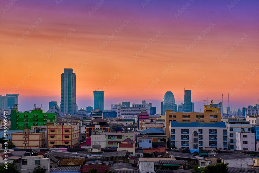 Colorful sunset over big city, downtown skyline and residential area. 