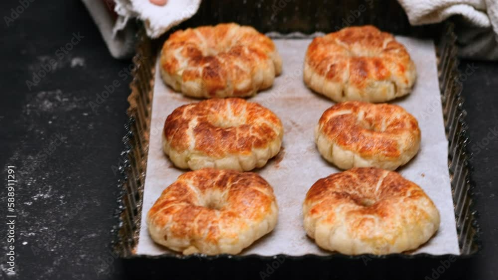 the cook prepared cinnamon rolls and put a hot baking sheet on the table. High quality 4k footage the cook prepared cinnamon rolls and put a hot baking sheet on the table. High quality 4k footage