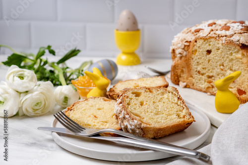 Italian Easter colomba cake with almonds and candied fruits and Easter eggs and holiday decorations easter bunny