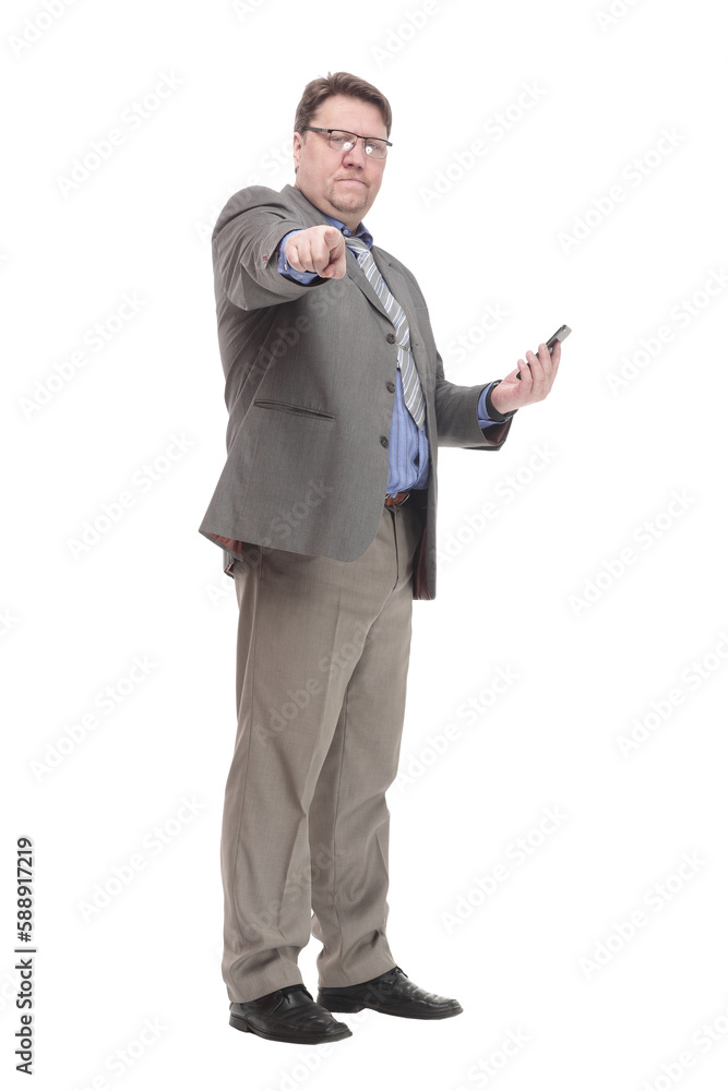 in full growth. serious business man with a smartphone. in full growth. serious business man with a smartphone.