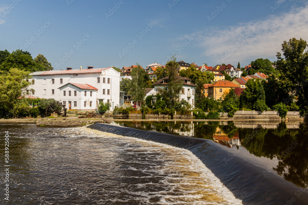 Fototapeta premium Vesely weir at Luznice river with a former mill in Tabor city, Czech Republic
