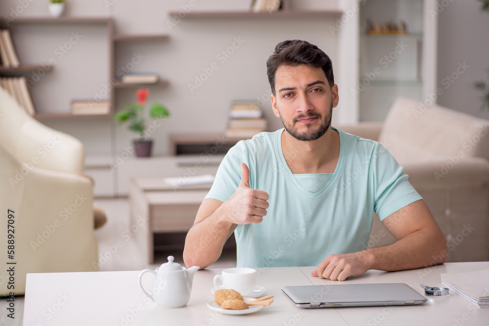 Young male freelancer working from home Young male freelancer working from home