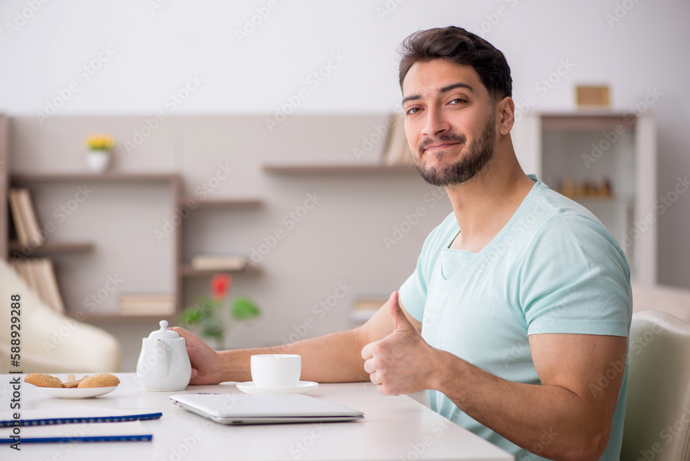 Young male freelancer working from home Young male freelancer working from home