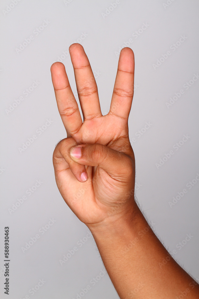 Hand shows number three , Number three index finger isolated background Hand shows number three , Number three index finger isolated background