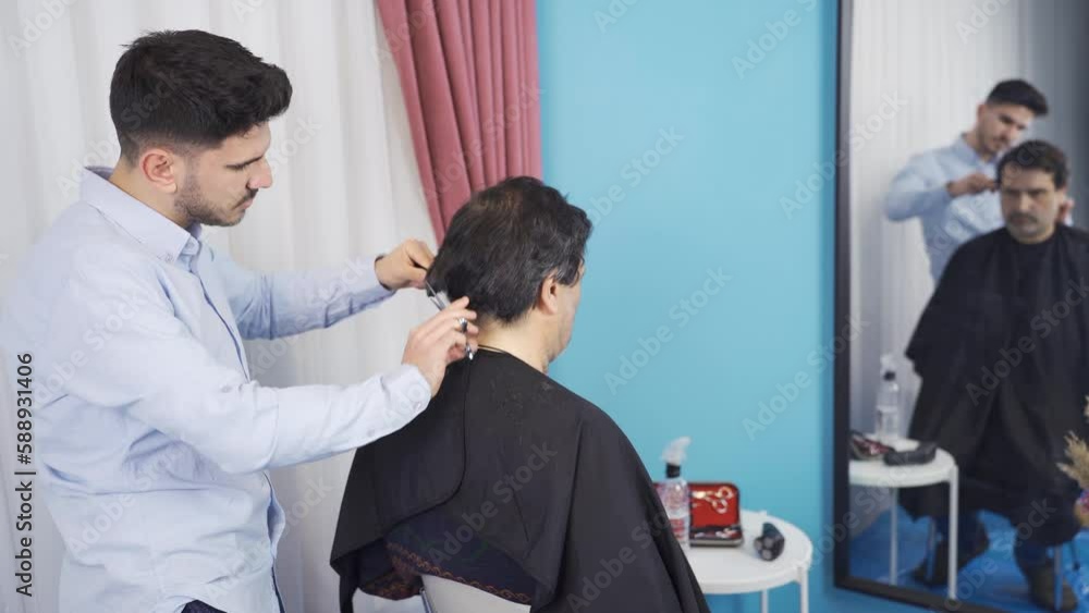 Carer shaves mentally ill man.
Carer shaving a mentally ill man's hair at home.
Carer shaves mentally ill man.
Carer shaving a mentally ill man's hair at home.