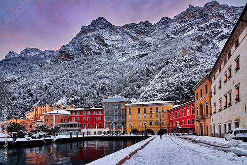 Riva del Garda town and Garda lake in the winter time on a snowy day,Trentino Alto Adige region