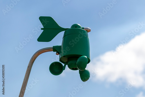 Weatherstation with anemometer, a meteorological instrument used to measure the wind speed and direction. photo