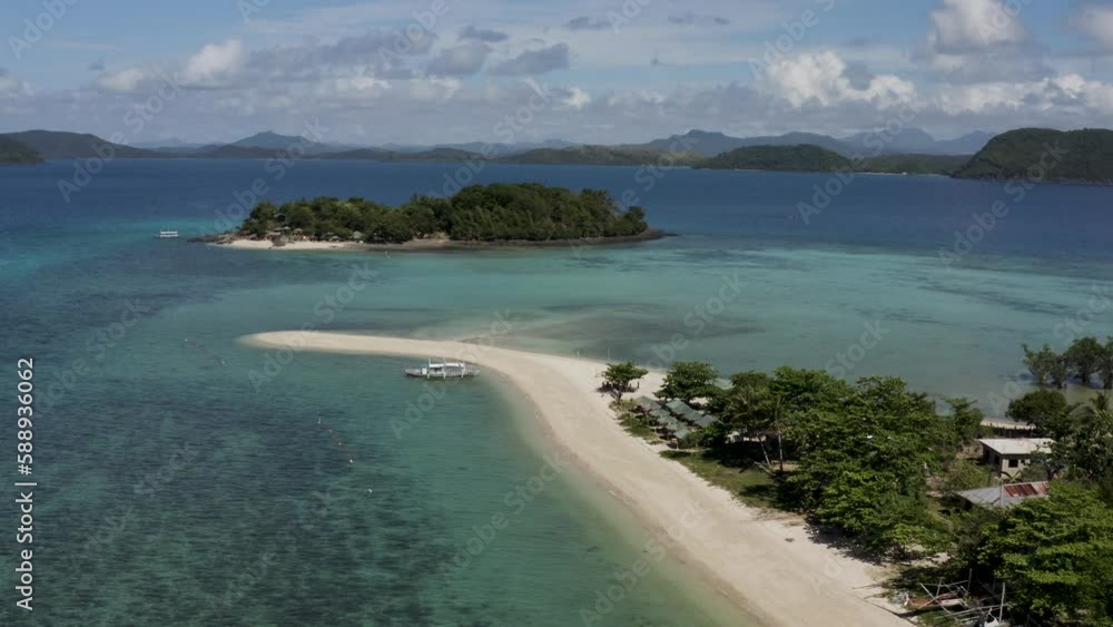 Aerial view of a catamaran moored along a white sand beach on Bohol Island, Central Visayas region, Philippines,. Aerial view of a catamaran moored along a white sand beach on Bohol Island, Central Visayas region, Philippines,.