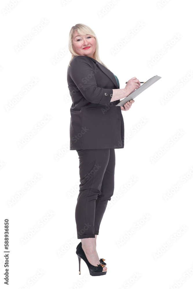 Mature woman making puts her signature in the clipboard . Mature woman making puts her signature in the clipboard .