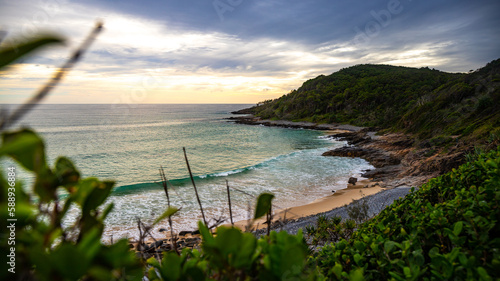 A beautiful cameral hidden little cove bay covered with greenery in Noosa National Park, Queensland, Australia photo