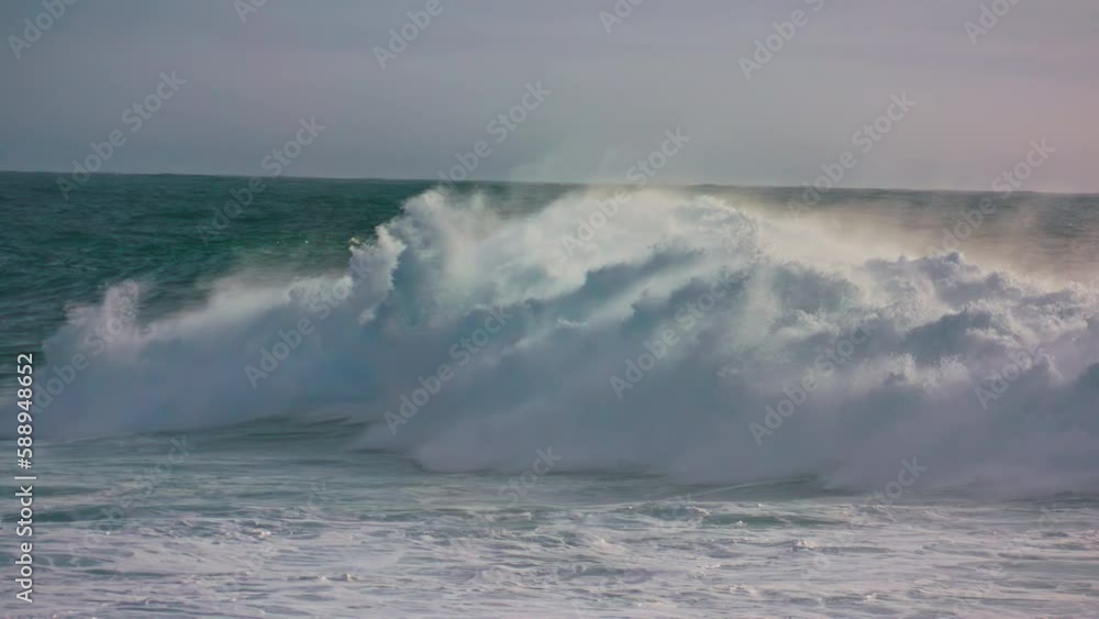 Storm waves rolling ocean surface making white foam. Powerful surf barreling in Storm waves rolling ocean surface making white foam. Powerful surf barreling in