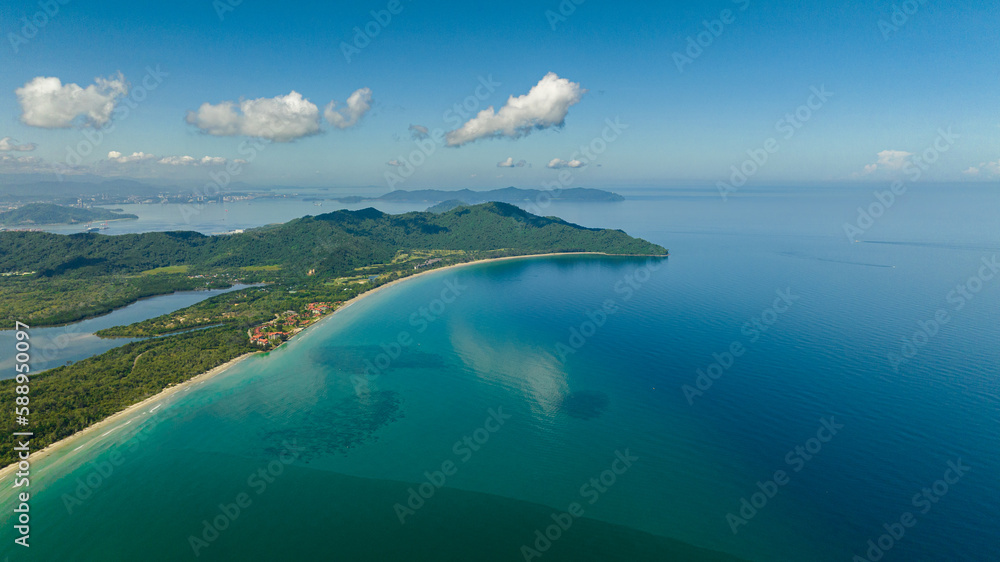 Aerial view of Borneo island coastline with beach and Kota Kinabalu city view. Malaysia.