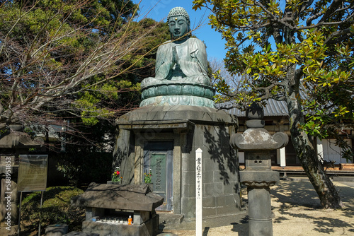 Tokyo, Japan - March 3, 2023: Bronze Buddha statue constructed in 1690 by Ota Kyuemon known as "Tennoji Daibutsu" at Tennoji Temple in Yanaka, Tokyo, Japan.