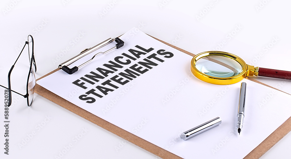 FINANCIAL STATEMENTS text on clipboard on white background, business concept FINANCIAL STATEMENTS text on clipboard on white background, business concept