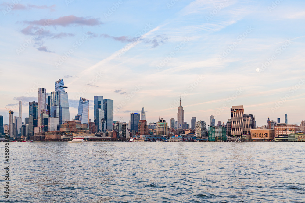 Naklejka premium Midtown NYC and Hudson Yards Sunset with Moon from Hoboken NJ