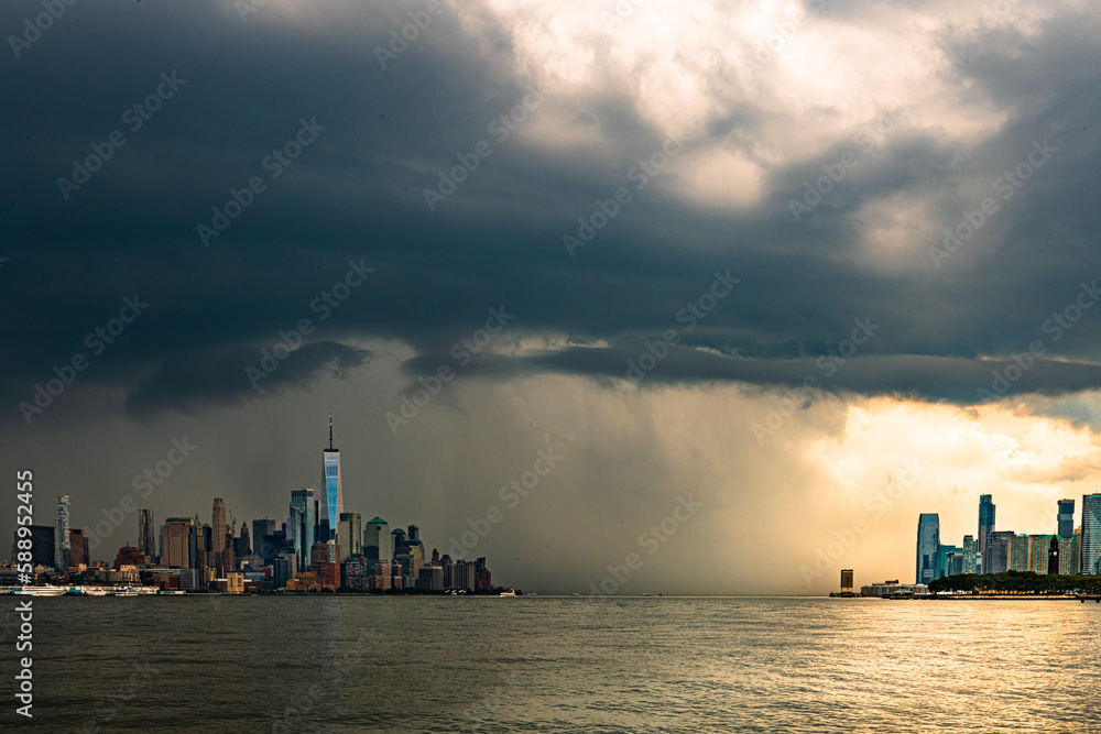 Lower Manhattan NYC and One World Trade Center with Dark Storm Cloud