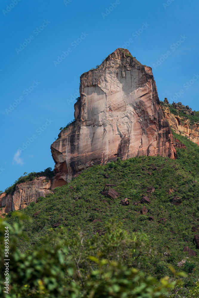 Majestic Sandstone Cliff Forming a Cathedral Shape Against a Blue Sky
