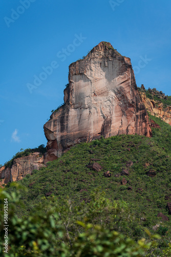 Majestic Sandstone Cliff Forming a Cathedral Shape Against a Blue Sky