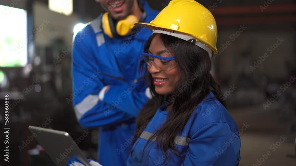 Team of mechanical engineer inspecting a machines in factory. Team of mechanical engineer inspecting a machines in factory.