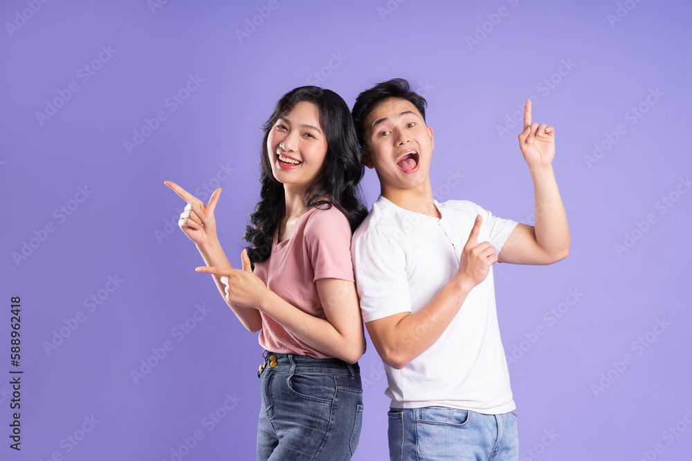 image of asian couple posing on purple background image of asian couple posing on purple background