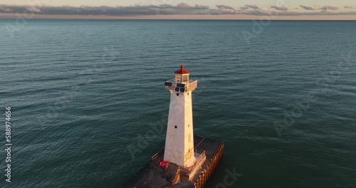 Early winter morning aerial video of Sodus Point Lighthouse, Sodus, New York. photo