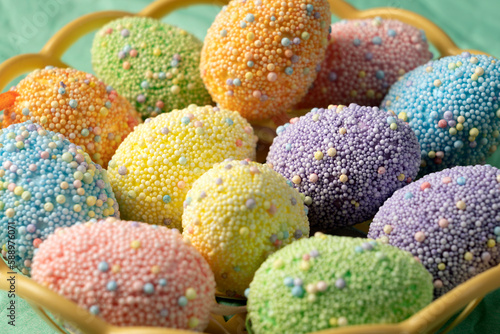 Decorative Easter eggs of different colors close-up