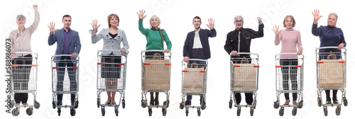 group of people with shopping cart showing thumbs up at camera