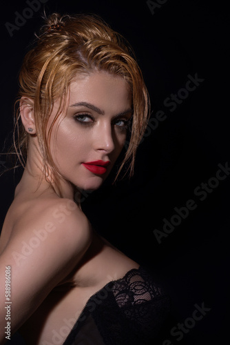 Fashion portrait of beautiful young model in studio. Fashionable woman with beauty face, soft skin, natural makeup, romantic look. Charming sexy sensual beautiful woman face close up.