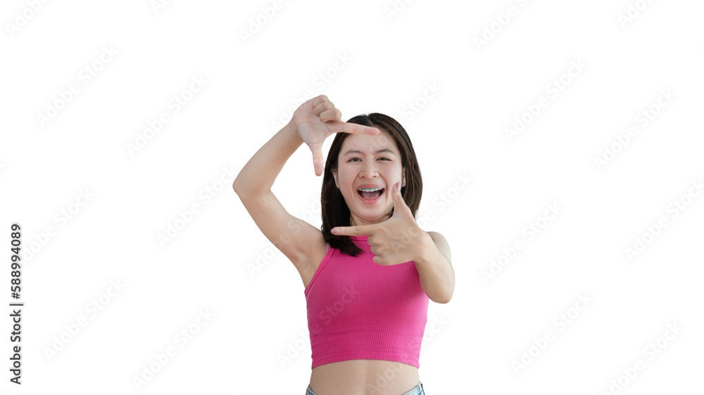 Playful young asian woman in good mood posing for photo or photo frame with fingers on yellow background, Use your fingers to act like a photograph, Mark as if taking a photo. Playful young asian woman in good mood posing for photo or photo frame with fingers on yellow background, Use your fingers to act like a photograph, Mark as if taking a photo.