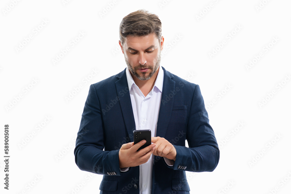 Handsome business man in suit using smartphone, chatting, making post on social media. Businessman call on phone isolated over studio background. Blogger talking on phone.