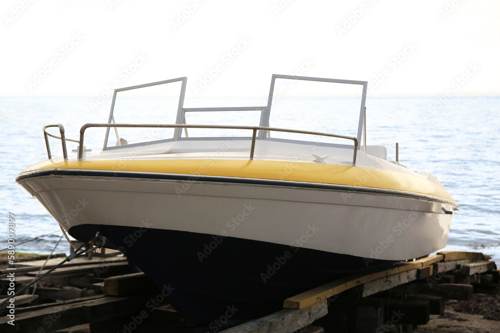 Fototapeta premium Moored boat on beach near sea outdoors