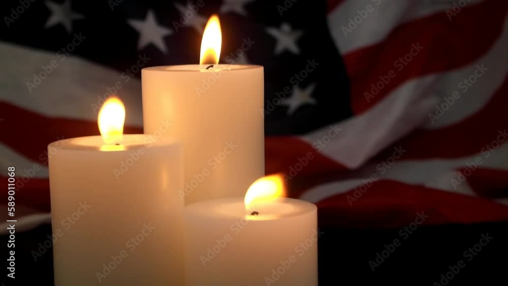 Three burning candles on wavy US flag background. Memorial day theme. Three burning candles on wavy US flag background. Memorial day theme.