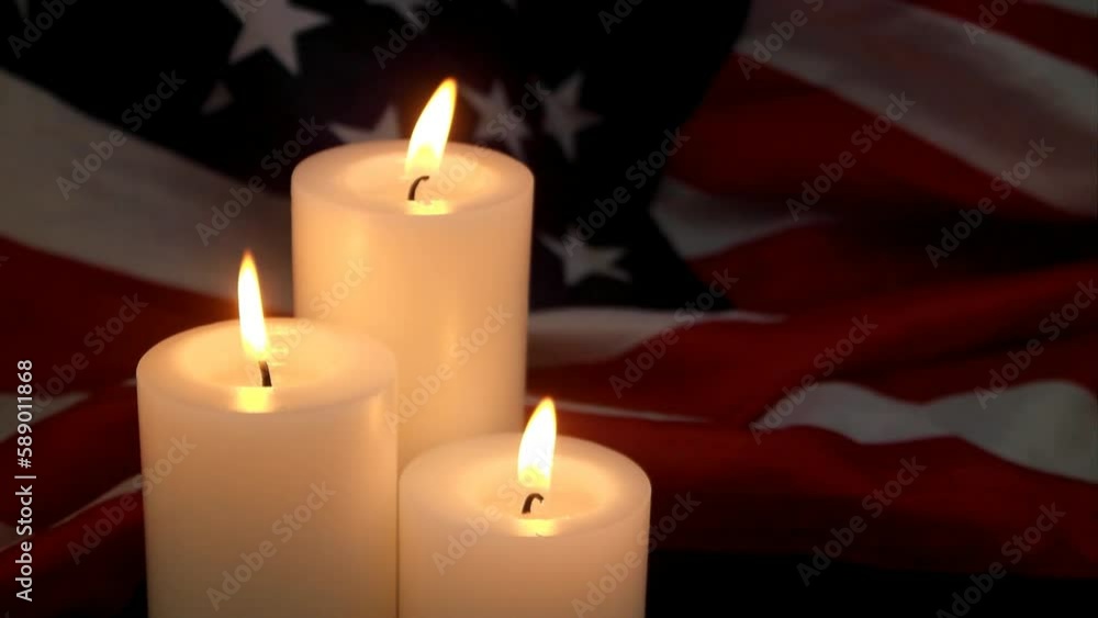 Three burning candles on American flag background. Memorial day concept. Three burning candles on American flag background. Memorial day concept.