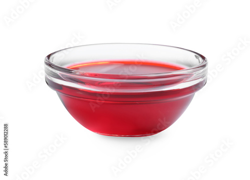 Glass bowl with red food coloring isolated on white