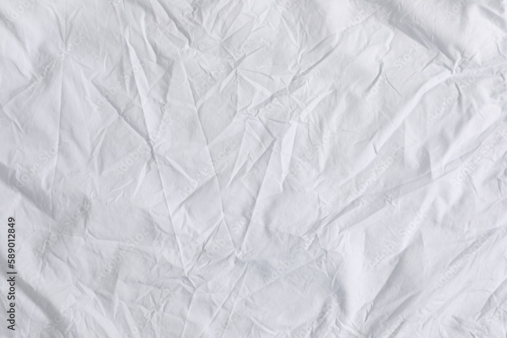 Fototapeta premium Crumpled white fabric as background, top view