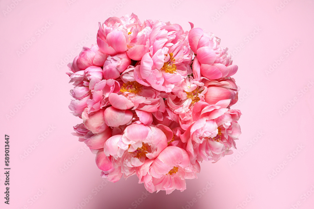 Bunch of beautiful peonies on pink background, top view Bunch of beautiful peonies on pink background, top view