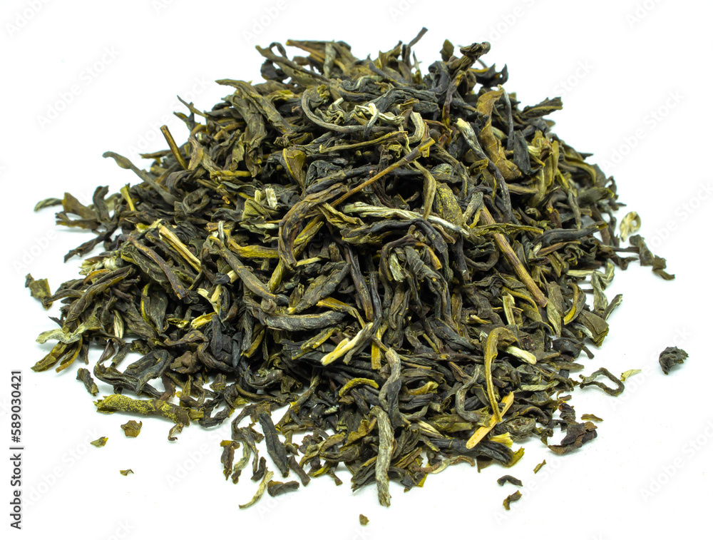 Herbal Green tea leaves piled on a white background with some leaves scattered around the edge of pile in studio lighting. Herbal Green tea leaves piled on a white background with some leaves scattered around the edge of pile in studio lighting.