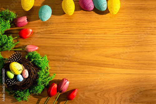colorful easter eggs tulips old wooden board happy easter space for inscription