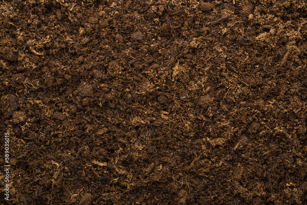 Dark brown soil background. Fresh ground preparation for garden season. Empty place for text. Top down view. Dark brown soil background. Fresh ground preparation for garden season. Empty place for text. Top down view.
