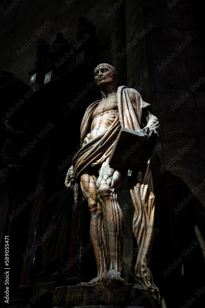 Naklejka premium Saint Bartholomew flayed, a masterpiece of the 1600's sculpture in the Duomo (Cathedral) of Milan, in Lombardy, northern Italy, Europe. 