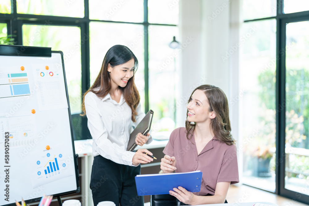 Fototapeta premium business woman using laptop or notebook computer with data analysis graph dashboard, confident woman working with computer laptop concept, contact idea design dashboard graph business conceptual.
